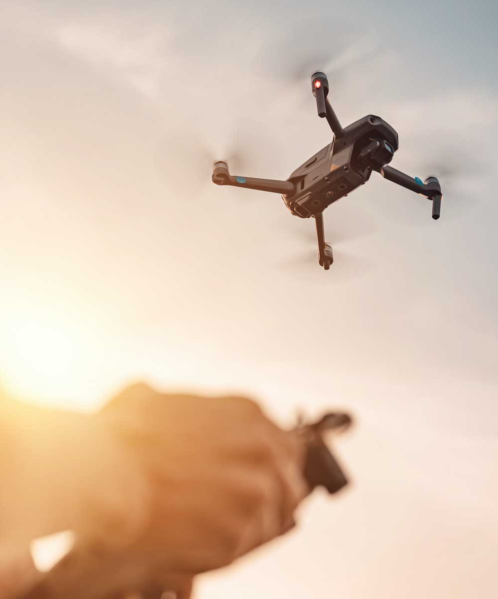 Drone operator flying a drone